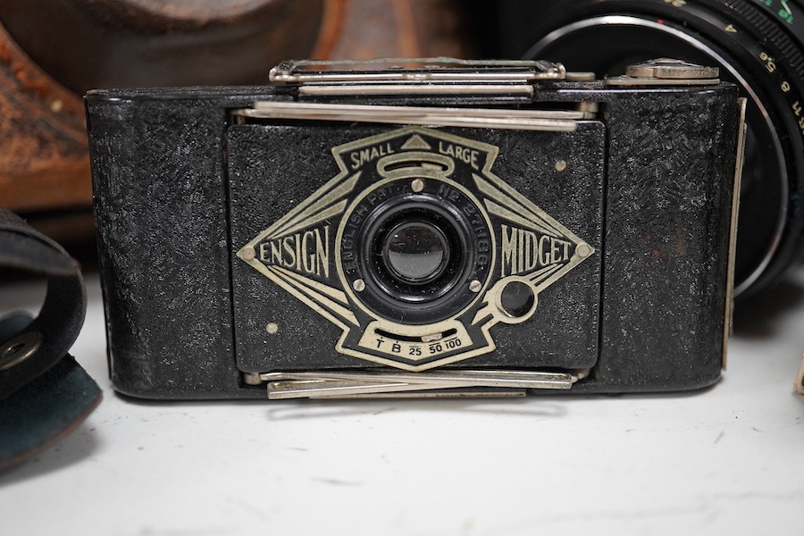 A Leica Model II camera in its original leather case, No. 204618, together with four additional cameras; a Zeiss Ikonta, a Zeiss Nettar, a Prinzflex 500E, and an Ensign Midget camera in its original card box with instruc